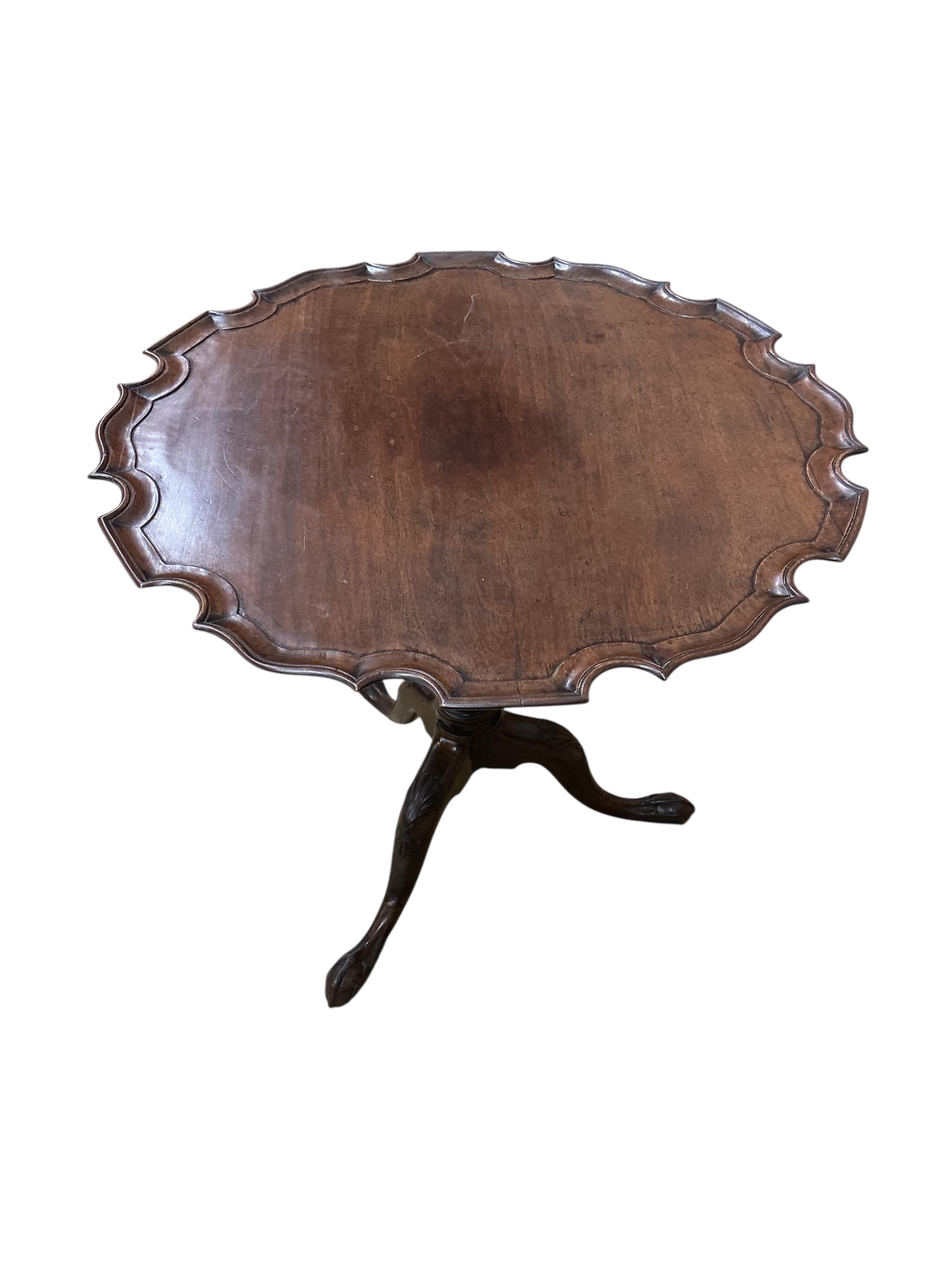 A George III piecrust circular tilt top tripod tea table, diameter 77cm, height 68cm